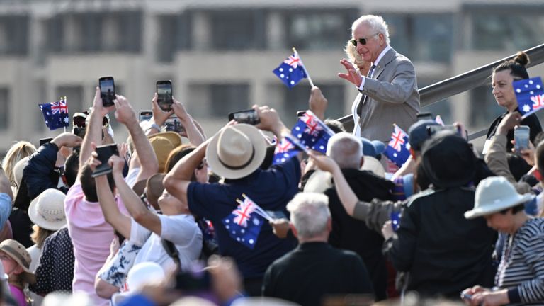 King Charles waves to members of the public during a visit to the Sydney Opera House.
Pic: AP