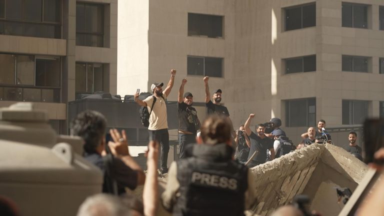 Several men mounted a concrete pile to give voice to the anger within