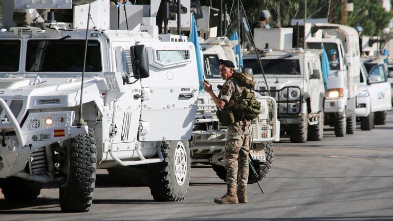 A Lebanese army soldier stands near UN peacekeepers (UNIFIL) vehicles in Marjayoun, near the border with Israel, amid ongoing hostilities between Hezbollah and Israeli forces, southern Lebanon October 29, 2024. REUTERS/Karamallah Daher TPX IMAGES OF THE DAY