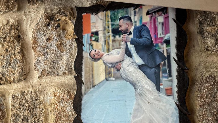 Mohammad's nephew and his wife on their wedding day. The young woman was killed in a strike