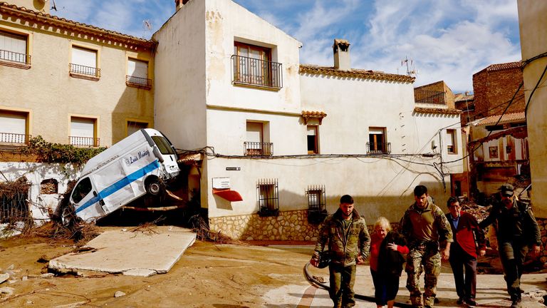 Encarna Rivero, 88, and her husband Jose Tomas, 89, are rescued after being stranded at a neighbours home  in Letur.
Pic: Reuters