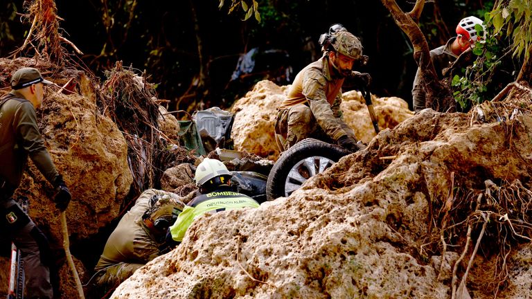 Members of a rescue team search for missing people near a river after heavy rains caused flooding in Letur, Spain
Pic: Reuters