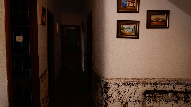 Watermarks showing the levels of floodwaters are seen inside a house after heavy rains caused flooding, in Letur, Spain, October 30, 2024. Pic: Reuters