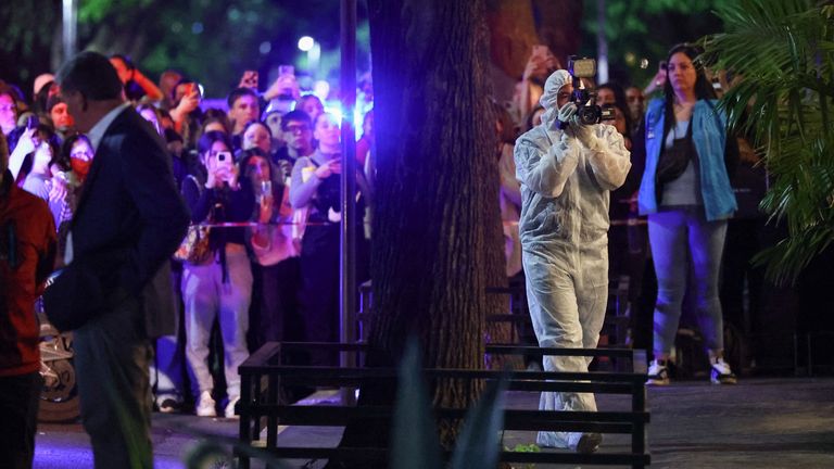 A forensic technician uses a video camera outside the hotel where Liam Payne, former One Direction member, was found dead, in Buenos Aires, Argentina, October 16, 2024. REUTERS/Agustin Marcarian
