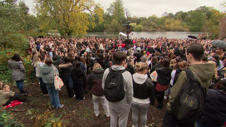 Crowds gather around the Peter Pan statue in Hyde Park on Sunday