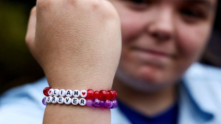 A fan shows her Liam Payne friendship bracelet on Sunday. Pic: Reuters