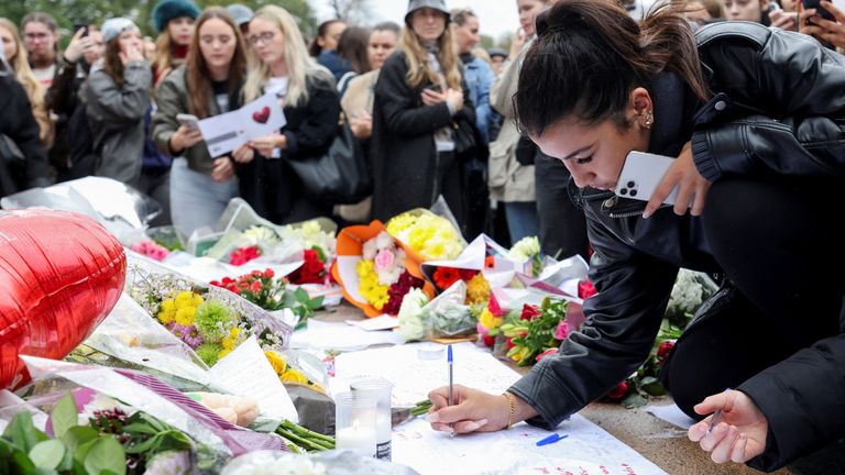 Fans write messages in memory of Payne. Pic: Reuters