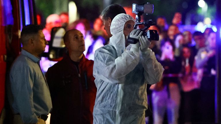 A forensic technician uses a video camera outside the hotel where Liam Payne, former One Direction member, was found dead, in Buenos Aires, Argentina, October 16, 2024. REUTERS/Agustin Marcarian
