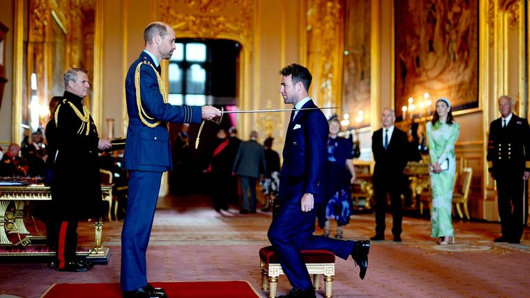 Sir Mark Cavendish is made a Knight by the Prince of Wales. Pic: Aaron Chown/PA