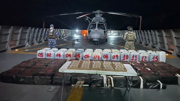 Members of the Mexican Navy stand guard next to packages on display after seizing some 8.4 thousand kilograms of illicit cargo and arresting 23 people in an operation off the country's southwestern Pacific coast, near Lazaro Cardenas, Michoacan, Mexico, in this undated handout photo released on October 18, 2024. Mexican Navy/Handout via REUTERS ATTENTION EDITORS - THIS IMAGE HAS BEEN SUPPLIED BY A THIRD PARTY. NO RESALES. NO ARCHIVES
