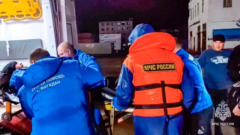 Russian emergency workers transfer Mikhail Pichugin into an ambulance ashore after he was rescued by a fishing vessel following 67 days adrift in the Sea of Okhotsk near the village of Ust-Khairuzovo in Kamchatk 
Pic: Russian Emergency Ministry Press Service/AP