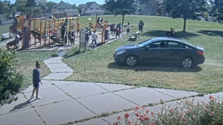 Adults could be seen telling the children to get out the way of the onrushing car. Pic: Minneapolis Police