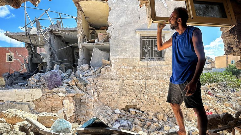 Mohammad in front of the apartment block