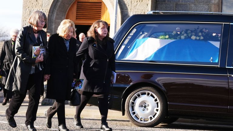 Moira Salmond (centre) leaves the funeral service for her husband former first minister of Scotland Alex Salmond.
Pic: PA