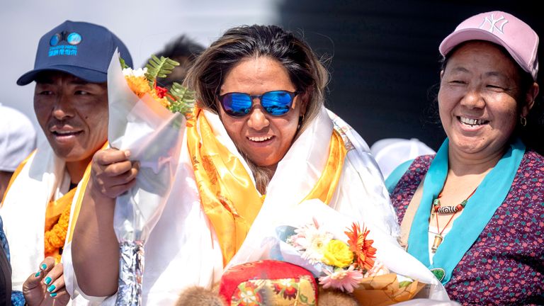 Family members of Dawa Yangzum Sherpa, the first Nepalese woman to scale the world's 14 highest peaks, welcome her upon her arrival at Tribhuvan International Airport in Kathmandu, Nepal.
Pic: AP