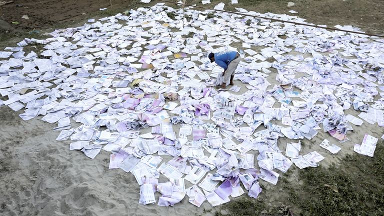 A man dries books which soaked water during the deadly flood following heavy rainfall along the bank of Bagmati River following heavy rains, in Kathmandu, Nepal.
Pic: Reuters