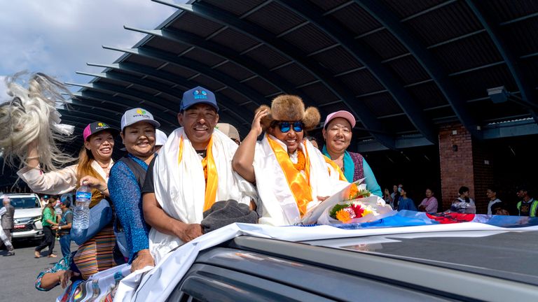 Family members of Dawa Yangzum Sherpa, the first Nepalese woman to scale the world's 14 highest peaks, welcome her upon her arrival at Tribhuvan International Airport in Kathmandu, Nepal.
Pic: AP