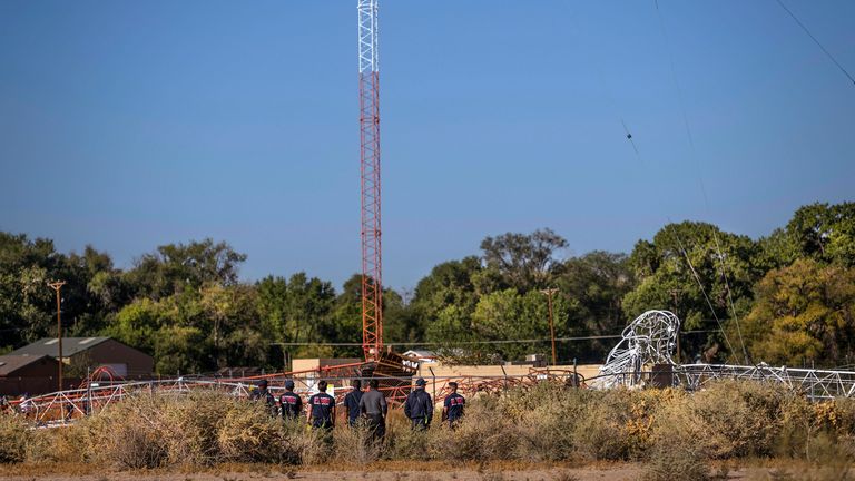 Albuquerque Fire Rescue repsonds to the scene after a hot air balloon hit a KKOB radio tower and knocked it over at 10511 Second NW in Albuquerque, N.M., on Friday, Oct. 11, 2024. (Chancey Bush/The Albuquerque Journal via AP)