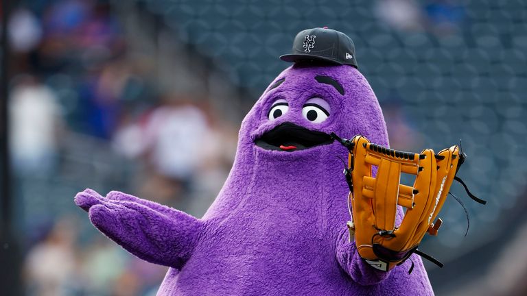 FILE - McDonald's character Grimace throws out a ceremonial first pitch before a baseball game between the Miami Marlins and the New York Mets, June 12, 2024, in New York. (AP Photo/Rich Schultz, File)