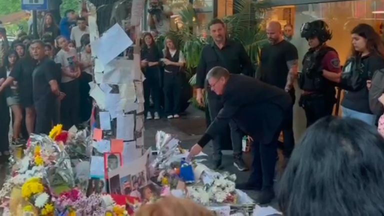 Liam Payne’s father reads tributes and kisses pictures outside Argentinian hotel where son died