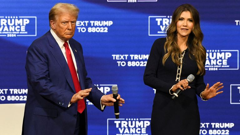 Donald Trump and South Dakota Governor Kristi Noem dance during a town hall campaign event in Oaks, Pennsylvania.
Pic:Reuters