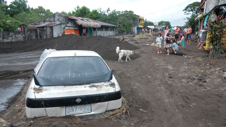 A car partially buried by volcanic mud that  flowed from a Mayon volcano after heavy rains caused by Tropical Storm Trami hit Guinobatan town, Albay province, Philippines.
Pic AP