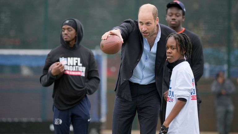 The Prince of Wales gestures as he speaks to a participant at  a NFL Foundation  Flag event.
Pic: AP