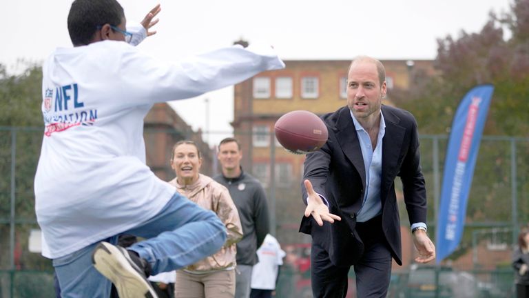 The Prince of Wales  throws a football he attends a NFL Foundation  Flag event.
Pic: AP