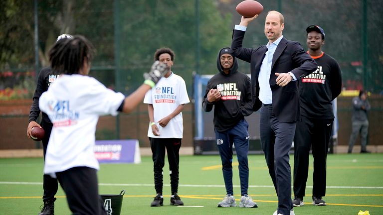 The Prince of Wales throws a football as he attends a NFL Foundation Flag event.
Pic: AP