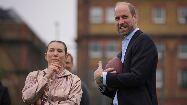 Prince William speaking to Phoebe Schecter. 
Pic: PA