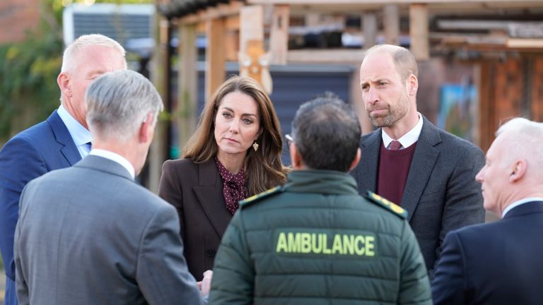 The Prince and Princess of Wales speak to members of the emergency services during a visit to Southport Community Centre. Pic: PA