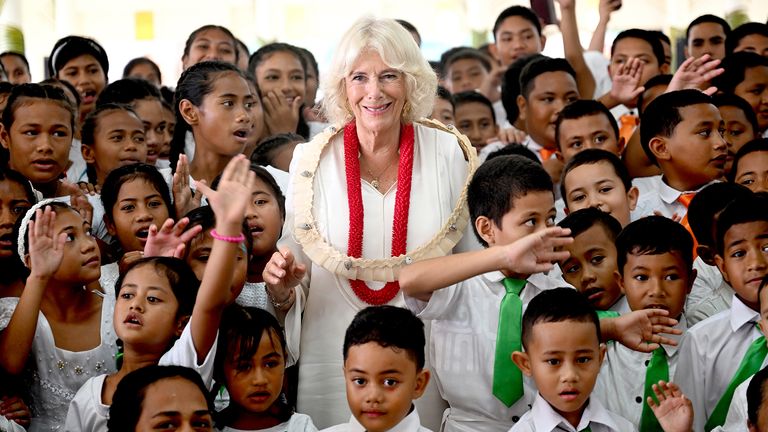 Queen Camilla with children from  Moata'a village's aoga faifeau.
Pic: PA