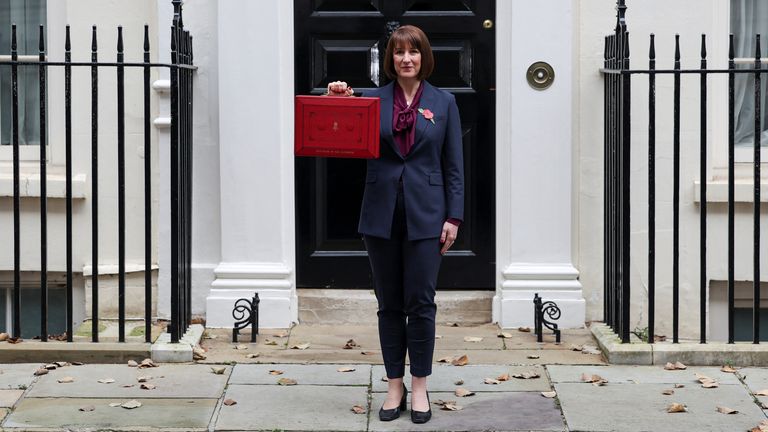 Britain's Chancellor of the Exchequer Rachel Reeves poses with the reddish  fund  container  extracurricular  her bureau   connected  Downing Street successful  London, Britain October 30, 2024. REUTERS/Isabel Infantes