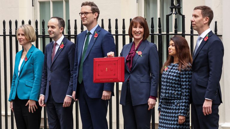 Britain's Chancellor of the Exchequer Rachel Reeves poses with the red budget box outside her office on Downing Street in London, Britain October 30, 2024. REUTERS/Mina Kim