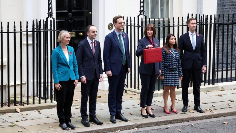 Rachel Reeves poses with the red budget box outside her office on Downing Street.
Pic: Reuters