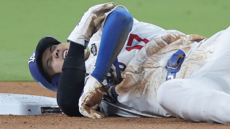 Shohei Ohtani gets hurt after sliding into second base during Game 2 of the baseball World Series. Pic: The Yomiuri Shimbun via AP Images