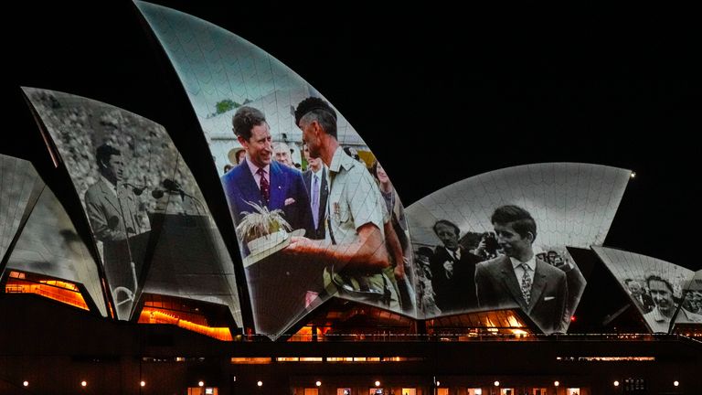 The Sydney Opera House sails show photos of King Charles and Queen Camilla. Pic: AP