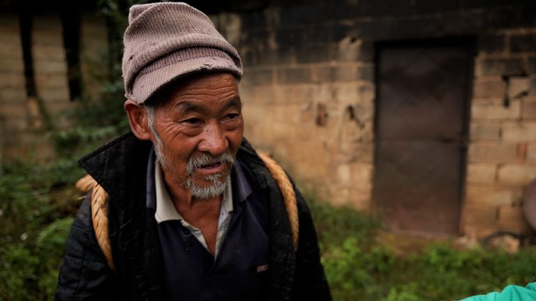 Mr Tan, a farmer from 'Kuangshan Zhen' or 'Mine Town, in Yunnan Province in southern China 