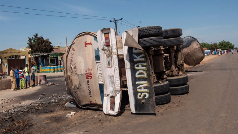 People gather at the scene of a tanker explosion in Majiya town Nigeria, Wednesday, Oct. 16, 2024. (AP Photo/Sani Maikatanga)