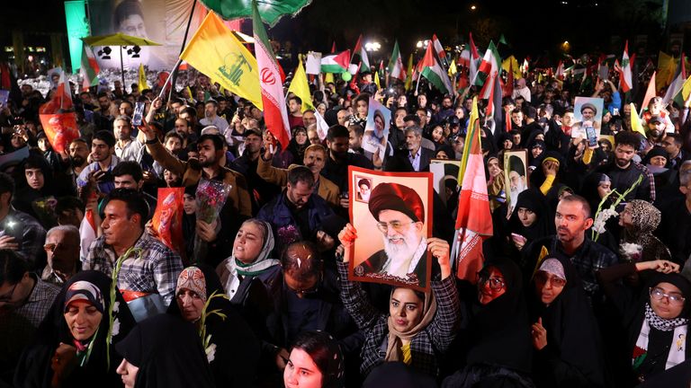 Iranians celebrate on a street after the IRGC attack on Israel, in Tehran, Iran, October 1, 2024. Majid Asgaripour/WANA (West Asia News Agency) via REUTERS ATTENTION EDITORS - THIS IMAGE HAS BEEN SUPPLIED BY A THIRD PARTY ATTENTION EDITORS - THIS PICTURE WAS PROVIDED BY A THIRD PARTY