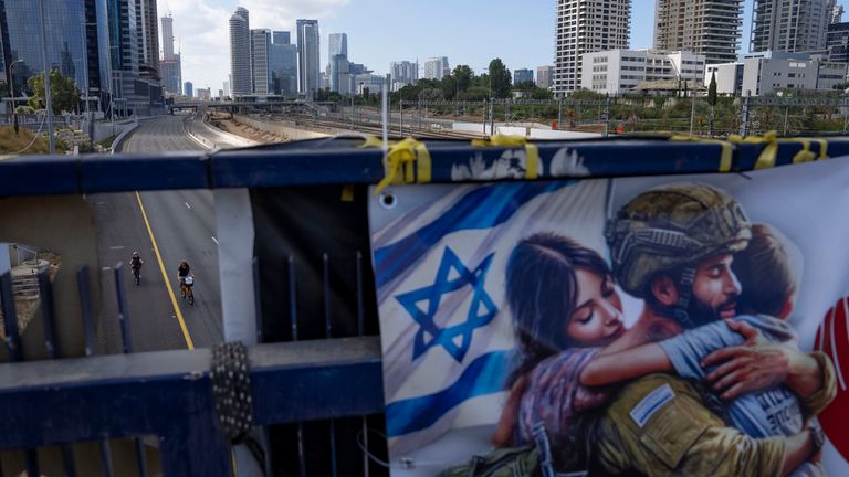 Cyclists ride on a car-free highway during the Jewish holiday of Yom Kippur in Tel Aviv, Israel, on Saturday, Oct. 12, 2024. (AP Photo/Oded Balilty)