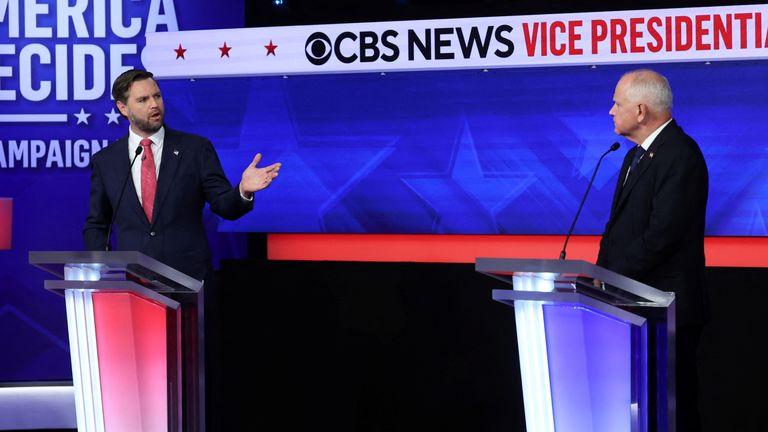 Tim Walz gestures while speaking during a debate with JD Vance. Image: Reuters