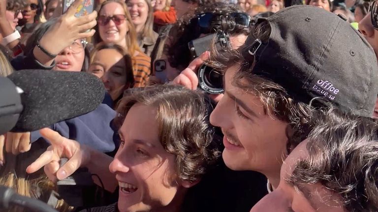 Timothee Chalamet (black cap) poses with contestants.  Pic:ITWEETABTTV/Reuters