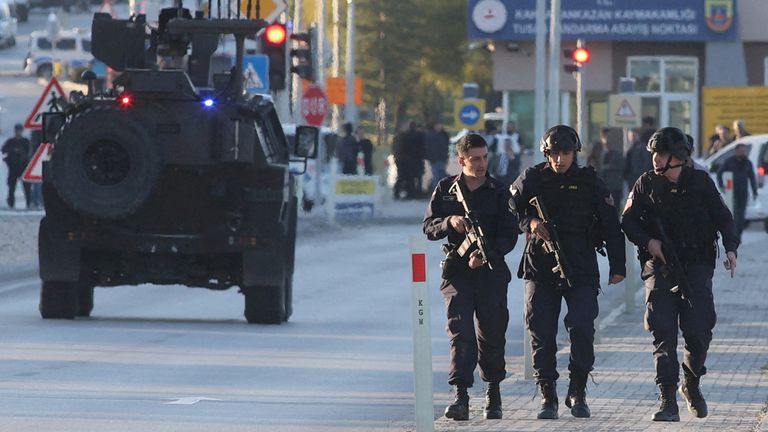 Armed security around the entrance to the company headquarters. Image: Reuters