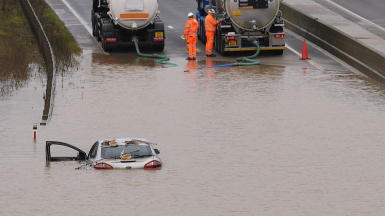 A car submerged in floodwater on the A421 in Marston Moretaine, Bedfordshire. Pic: PA