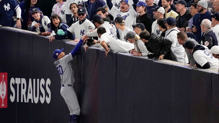 One fan grabbed the players glove and took the ball.
Pic: AP