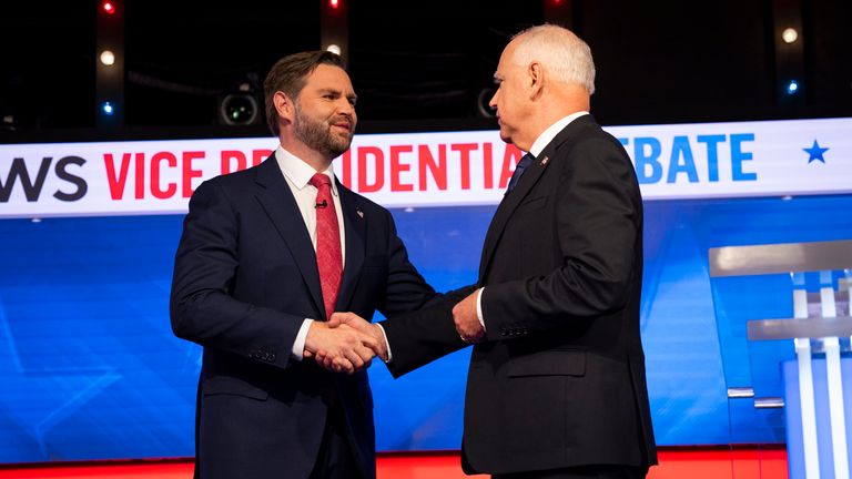 Tim Walz (R) and JD Vance shake hands at the 2024 Vice Presidential Debate Pic: AP