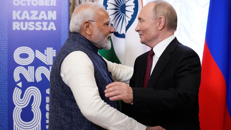 Vladimir Putin embraces Narendra Modi during their meeting on the sidelines of the BRICS Summit in Kazan, Russia