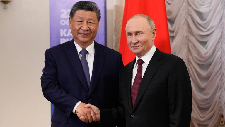 Russian President Vladimir Putin, right, and Chinese President Xi Jinping shake hands during their meeting on the sidelines of BRICS Summit at Kazan Kremlin in Kazan, Russia, Tuesday, Oct. 22, 2024. (AP Photo/Alexander Zemlianichenko, Pool)