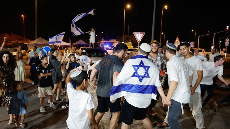 People react after Israeli military said they have killed Hamas leader Yahya Sinwar, in Sderot, Israel, October 17, 2024. REUTERS/Amir Cohen